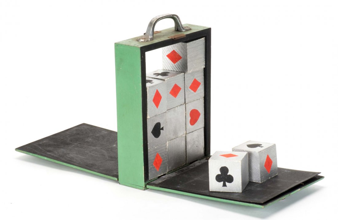 Curious Cubes. English, ca. 1950. Twelve wooden cubes: Curious Cubes. English, ca. 1950. Twelve wooden cubes placed into a wooden cabinet at random magically rearrange themselves to reveal the identity of a selected card. Cardboard gimmick. 6 x 2 8 ”. P