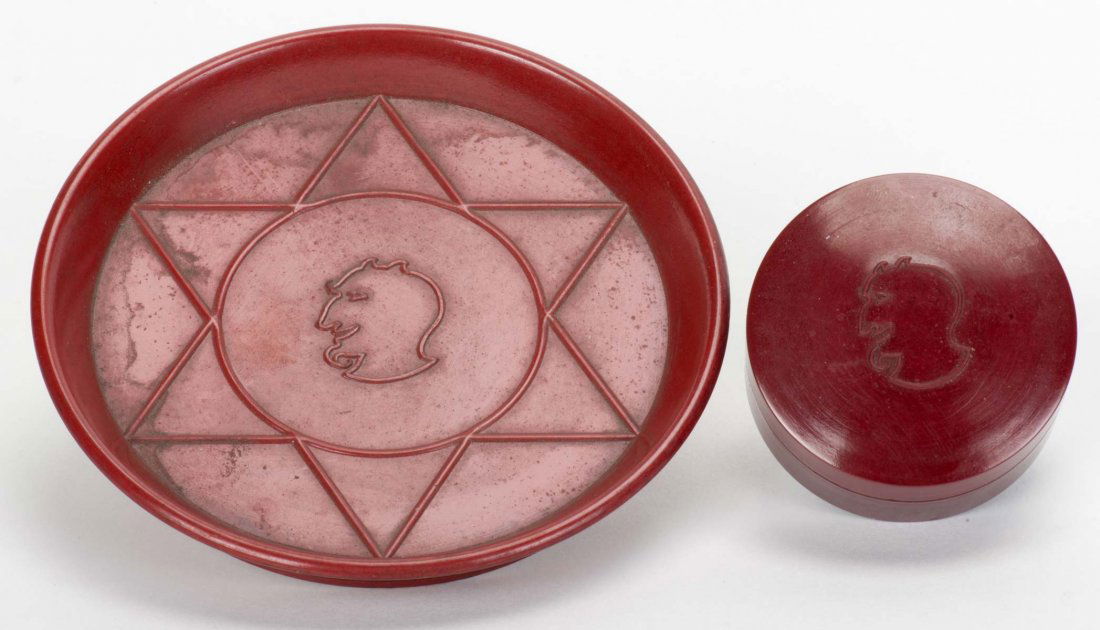 Two Demon Magic Props. London: Davenports, ca. 1940s.: Two Demon Magic Props. London: Davenports, ca. 1940s. Including a set of four nesting boxes (outermost 1 5/8” diam.) and a coin tray (3 5/8” diam.). Bakelite construction. Hallmarked with Demon lo