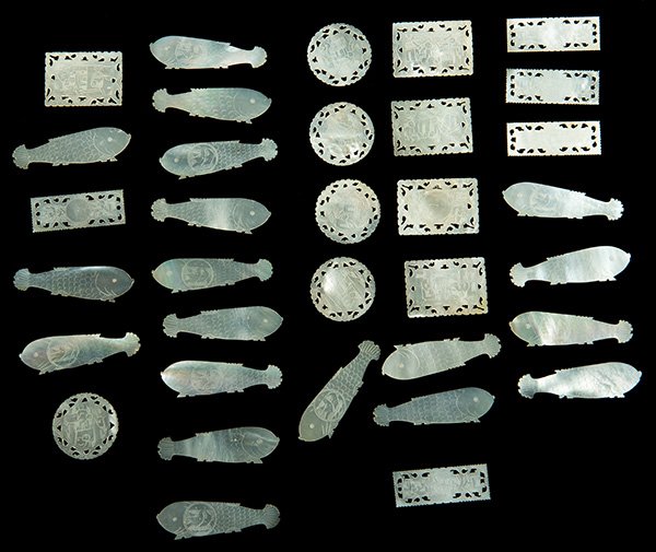 Group of 33 Scrimshawed Mother of Pearl Chinese Gaming: Group of 33 Scrimshawed Mother of Pearl Chinese Gaming Chips. Circa 1880. Including 18 fish-shaped, five round, five long rectangular and five short rectangular chips all ornately scrimshawed. Excelle