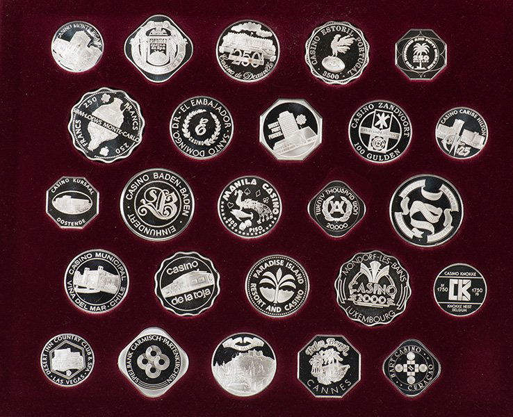 Gaming Coins of the World's Great Casinos. Franklin: Gaming Coins of the World's Great Casinos. Franklin Mint, 1978. Set of 25 sterling silver gaming coins from as many casinos, housed in a maroon display case. Very good.