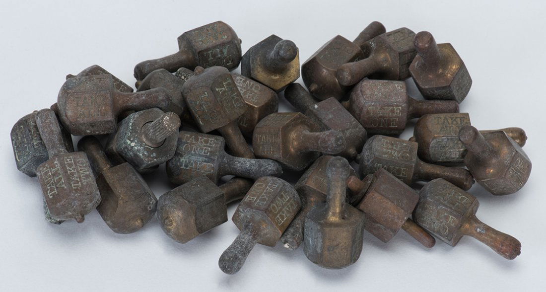 Group of 27 Brass Put and Take Tops. American, various (1 of 1)