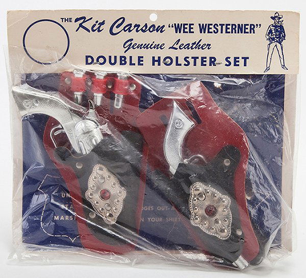 Kit Carson Wee Westerner Double Holster Cap Gun: Kit Carson Wee Westerner Double Holster Cap Gun Set. Circa 1960s. Two cap guns with holsters and accessories, in original pictorial packaging. Very good.