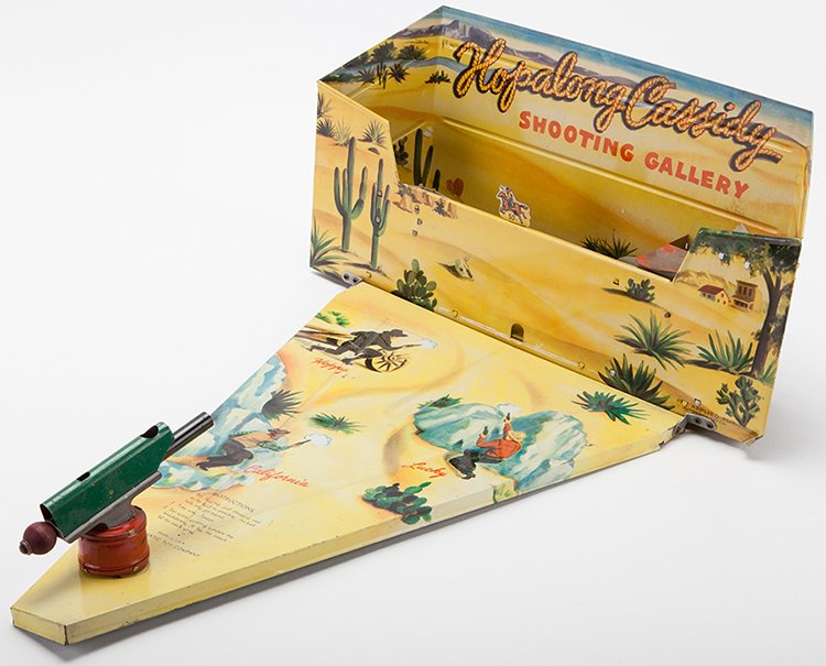 Hopalong Cassidy Shooting Gallery. USA: Automatic Toy: Hopalong Cassidy Shooting Gallery. USA: Automatic Toy Co., ca. 1950s. Mechanical shooting gallery made mostly of lithographed tin. Includes original gun and targets. Approximately 18 x 7 _. Some light