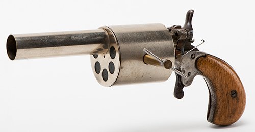 Silk Pistol. Hamburg: Conradi, ca. 1920 [?]. A: Silk Pistol. Hamburg: Conradi, ca. 1920 [?]. A handkerchief draped over the barrel of the gun vanishes when the trigger is pulled. Wooden handle, plated brass mechanism. 7 " long. With original key. G