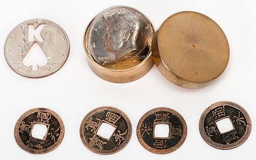 Sawa's Coin Box. Japan: Rabbit Co., 1970s. Number 33: Sawa's Coin Box. Japan: Rabbit Co., 1970s. Number 33 from an unknown limitation, engraved on the underside. Specially-prepared brass coin box and six gimmicked coins, housed in a velvet case, with ori