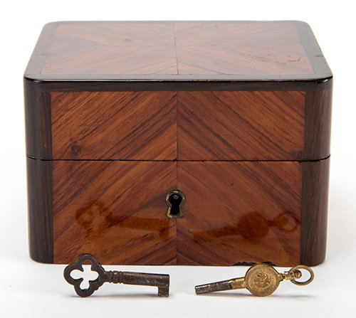 Ticking Watch Box. European, ca. 1870s. A borrowed: Ticking Watch Box. European, ca. 1870s. A borrowed watch is locked inside the beautifully crafted mahogany box, cloth-lined and bearing a mirror on the inside lid. The box is left on a table and conti