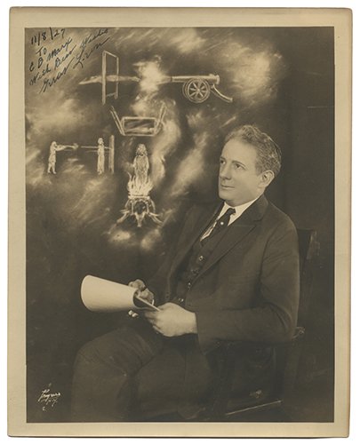 Leon (Leon Levy). Inscribed and Signed Portrait of The: Leon (Leon Levy). Inscribed and Signed Portrait of The Great Leon. New York: Progress studio, ca. 1926. The inventive American magician sits in a chair with a sheaf of notepaper in his hands, images o