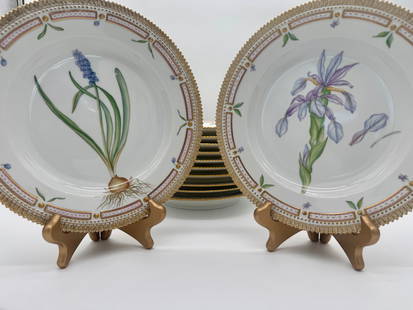 Royal Copenhagen 'Flora Danica' 10 1/4 Inch Dinner Plates (Set of 12): Set of twelve Royal Copenhagen 'Flora Danica' porcelain dinner plates, model number 3549, measuring 10 1/4 inches in diameter. Each plate is a hand-painted botanical treasure, bordered with intricate