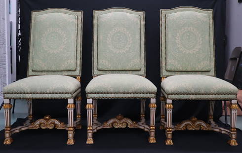 Set of Eight Louis XIV Style Painted and Giltwood Side Chairs 20"X42" Each: A richly detailed set of eight Louis XIV style side chairs featuring carved and giltwood frames with original painted finish. Each chair showcases classical French Baroque elements including fluted le
