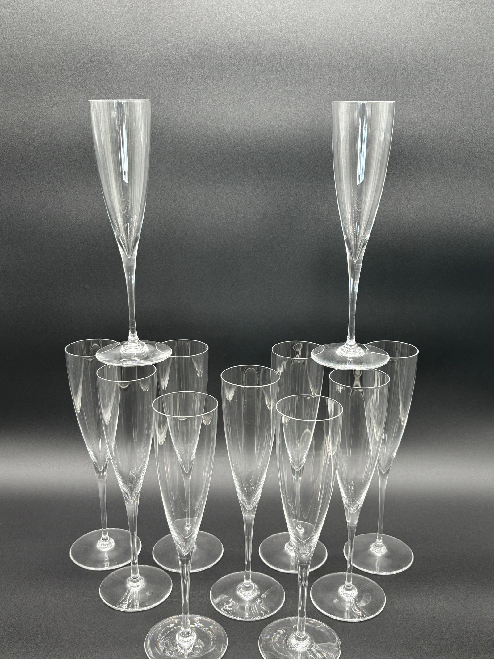 Baccarat Crystal Champagne Glasses Lot of 11 (Long) C.1970's: Type: Baccarat Crystal Glasses Quantity: Lot of 11 Dimensions: Length: 9.25" Width: 2.75" Depth: 5" Origin: France Wines of a light colored nature are best tasting within glasses of this size