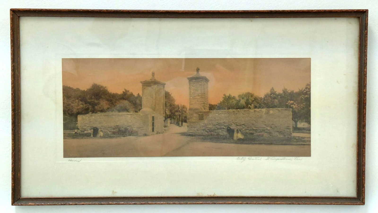 James Harris Colored Engraving 7x17- 'City Gates, St. Augustine': Harris, William James (1868-1940) Florida. Hand-colored engraving circa 1920's, 'City Gates, St. Augustine' Signed lower right, titled lower left. matted and framed under glass. 7 x 17 ( x inch with f