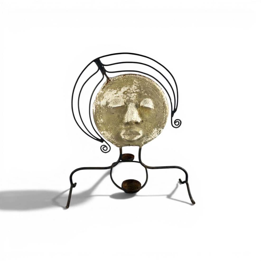 French work Decorative ornament depicting a female face Plaster and solid iron Date of creation:: French workDecorative ornament depicting a female face Plaster and solid iron Date of creation: circa 1940 H60 W54 D32 cmAn elegant decorative piece consisting of a stylized, patinated plaster face