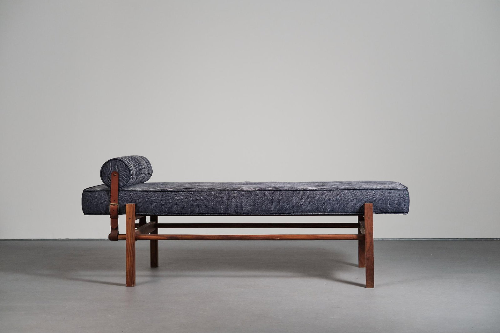 Nico Guevara Daybed Bench Oiled walnut, ikat cotton, linen, vegetable-tanned leather, brass, and: Nico GuevaraDaybed Bench Oiled walnut, ikat cotton, linen, vegetable-tanned leather, brass, and foamSigned by the artist H75 W180 D45 cm Nico Guevara studied industrial design at the Massana School