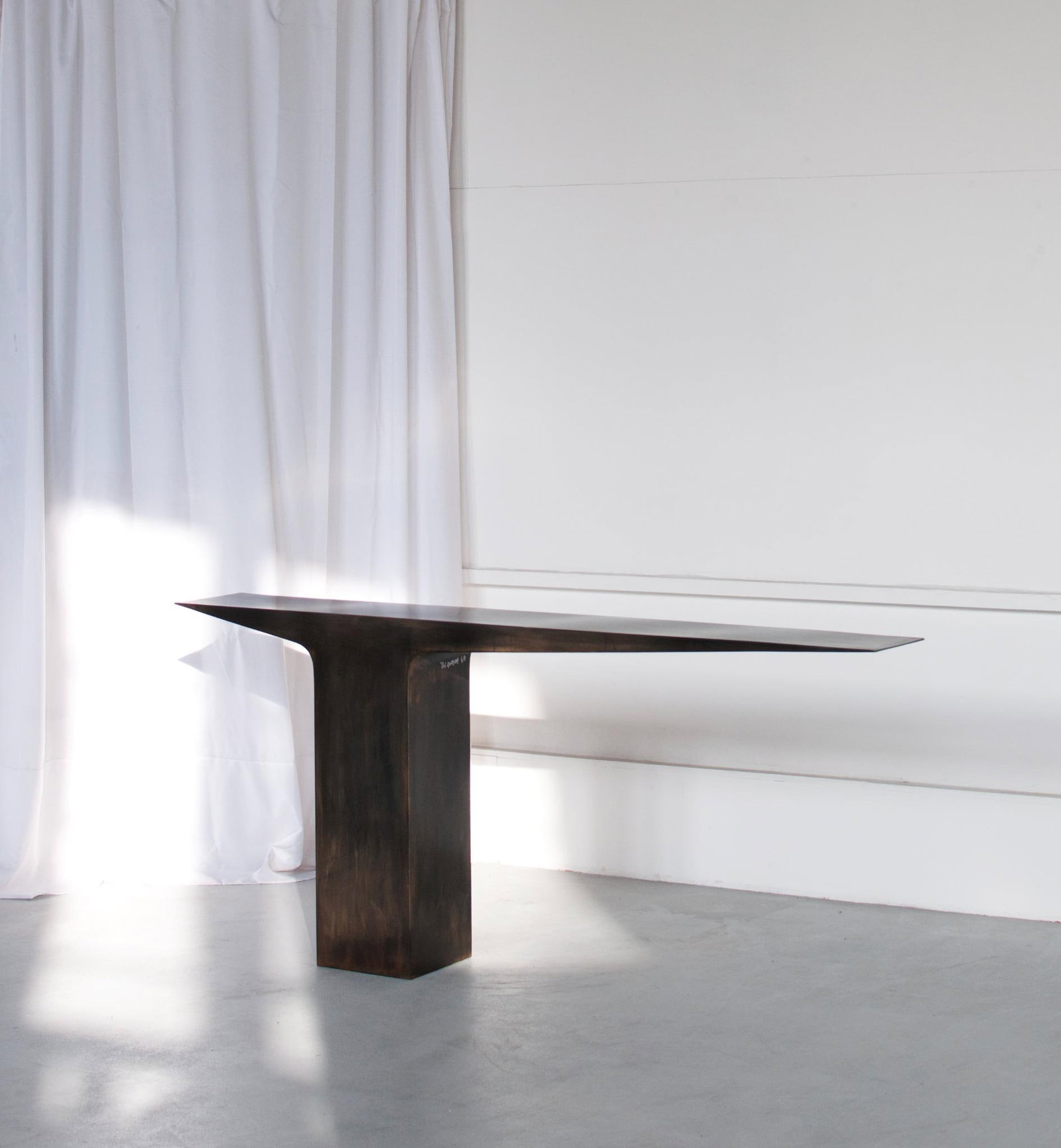 Pol Quadens (b. 1960) Blade Black Console Chocolate-black patinated steel Limited edition of 8: Pol Quadens (b. 1960)Blade Black Console Chocolate-black patinated steel Limited edition of 8 pieces + 4 artist's proofsSigned H95 W200 D30 cmSelf-taught, Pol Quadens single-handedly embodies the