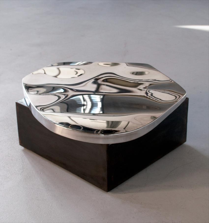 Pol Quadens (b. 1960) Pebble Table Polished stainless steel top Chocolate-black patinated steel: Pol Quadens (b. 1960)Pebble Table Polished stainless steel top Chocolate-black patinated steel base Limited edition of 8 pieces + 4 artist?s proofsSigned H35 W100 D100 cm Self-taught, Pol Quadens