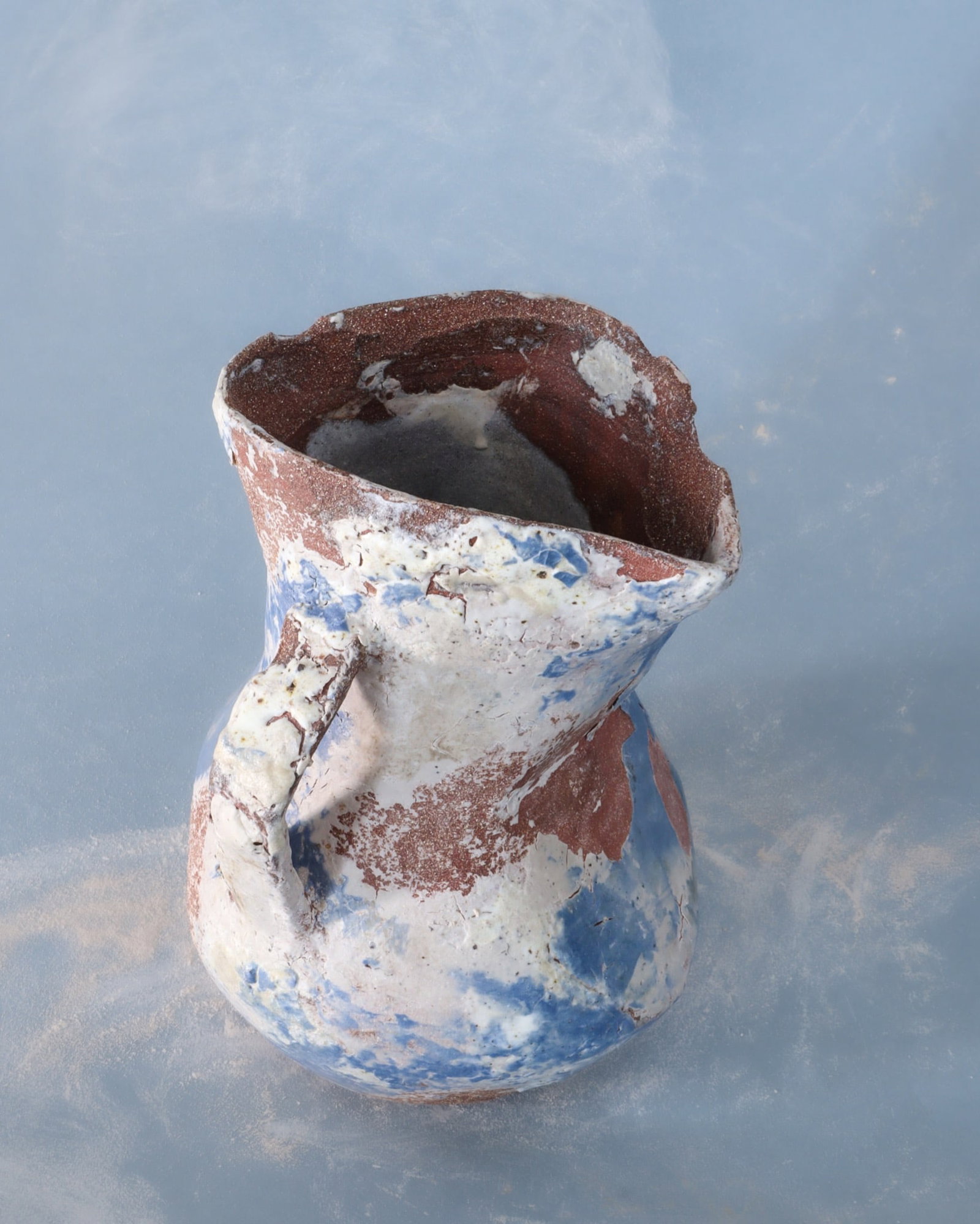 Santiago Sahli Gressus 4 Wheel-thrown red stoneware vase Shaped with a mallet Experimental engobes: Santiago SahliGressus 4Wheel-thrown red stoneware vaseShaped with a malletExperimental engobes made with porcelain, cobalt oxide, and mineralsControlled deterioration techniquesInterior glaze made fro