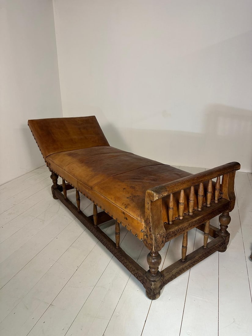 NORWAY, 18th–19th CENTURY Daybed Carved and turned wood Upholstery and leather restored, late: NORWAY, 18th–19th CENTURYDaybedCarved and turned woodUpholstery and leather restored, late 19th–early 20th century.H80 L210 D83 cmBeautiful patina from use. Wear, marks, scratches, and color varia