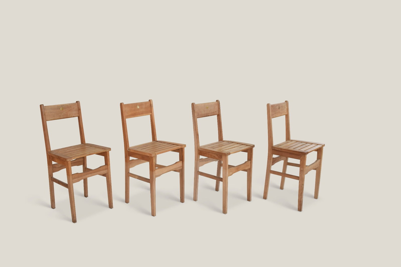 Aldo Rossi (1931–1997) AR2: Aldo Rossi (1931–1997)Model AR2Set of four chairsBeech wood, brass, and cherry woodProduced by Bruno Longoni, CantùDesigned in 1982–1983H80 W37 D32 cmProvenance: from Aldo Rossi’s studioExhibit