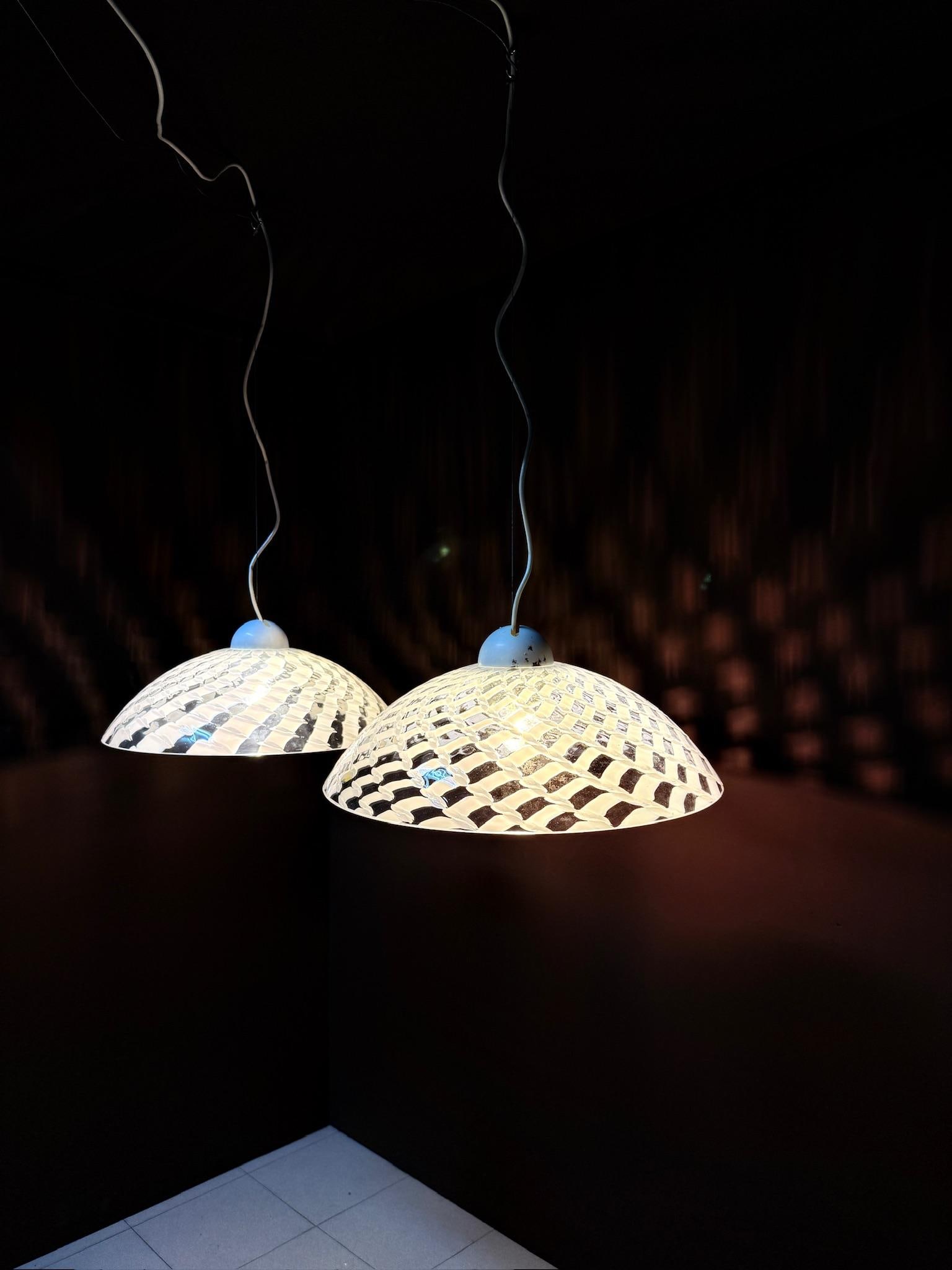 Carlon Nason (born in 1935) LS106 Pair of pendant lamps: Carlon Nason (born in 1935)LS106Pair of pendant lampsHand-blown Murano glass, chrome-plated metalH 14 D 40 cm