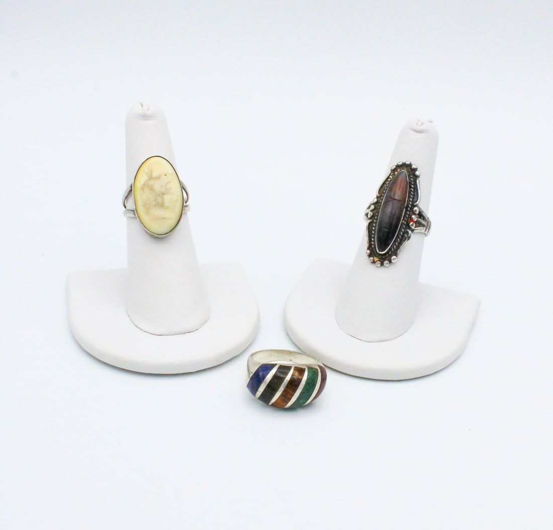 Grouping of Sterling Rings with Stones and Scrimshaw, 7.5, 6.5: Grouping of Sterling Rings with Stones and Scrimshaw Interesting Grouping of three Sterling Rings, all very unique in it's design. Inlaid Multi-Stone Ring is a size 7.5 and marked 925 Mex. Scrimshaw r