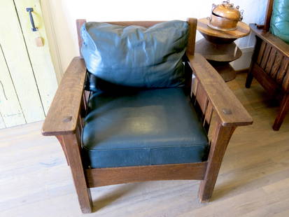 Charles Stickley Arts & Crafts Easy Chair: A beautiful antique Mission or Arts & Crafts chair by Charles Stickley. Quarter sawn oak, with original green leather upholstered seat cushions. Charles Stickley married into the Brandt family in 1891