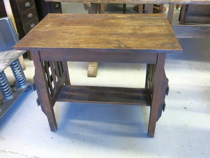 Antique Mission Style Oak Library Table with Side Racks: From the early part of the 20th century in the midst of the arts & crafts and mission style period.
