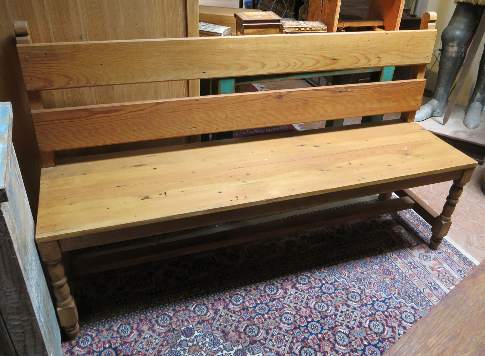 Pine Trestle Porch Bench with Two Plank Back: Small porch or mudroom pine bench with a two plank back, turned front legs and trestle stretcher.