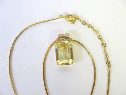 Christian Dior Gold Colored Chain with Yellow Stone: CD initial gold clasp with Chris. Dior © stamped on reverse. Gold rhinestone center with three baguette cut rhinestones above. Chain 17"
