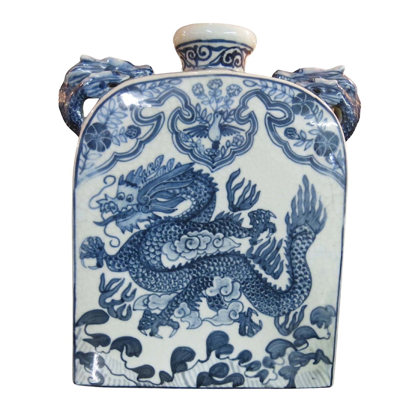 Rectangular Chinese Porcelain Dragon Vase: Painted in the Ming style with significant craqueler, this vase is likely a later homage to a period piece. A rampant dragon on each side with a dove above, applied triple dragon handles with a foliat