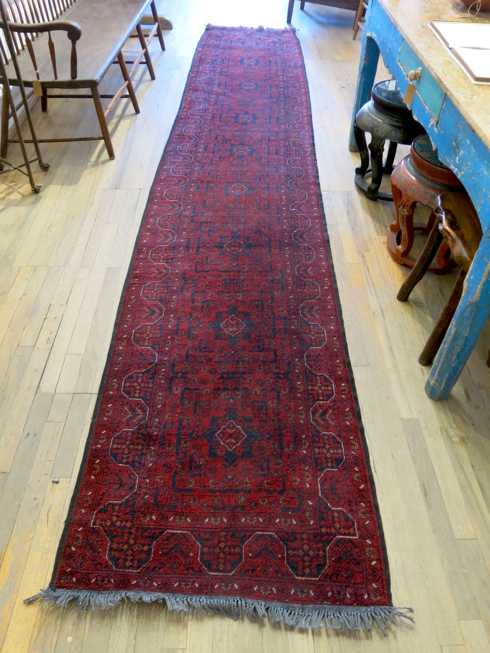 Khal Mohammadi Wool Rug Red Maimana Runner: Nine center medallions on a red field in a distinctive stacked geometric pattern. Hand-woven in the ancient weaving centers of Afghanistan, these exquisite kilims embody the timeless tradition of flat