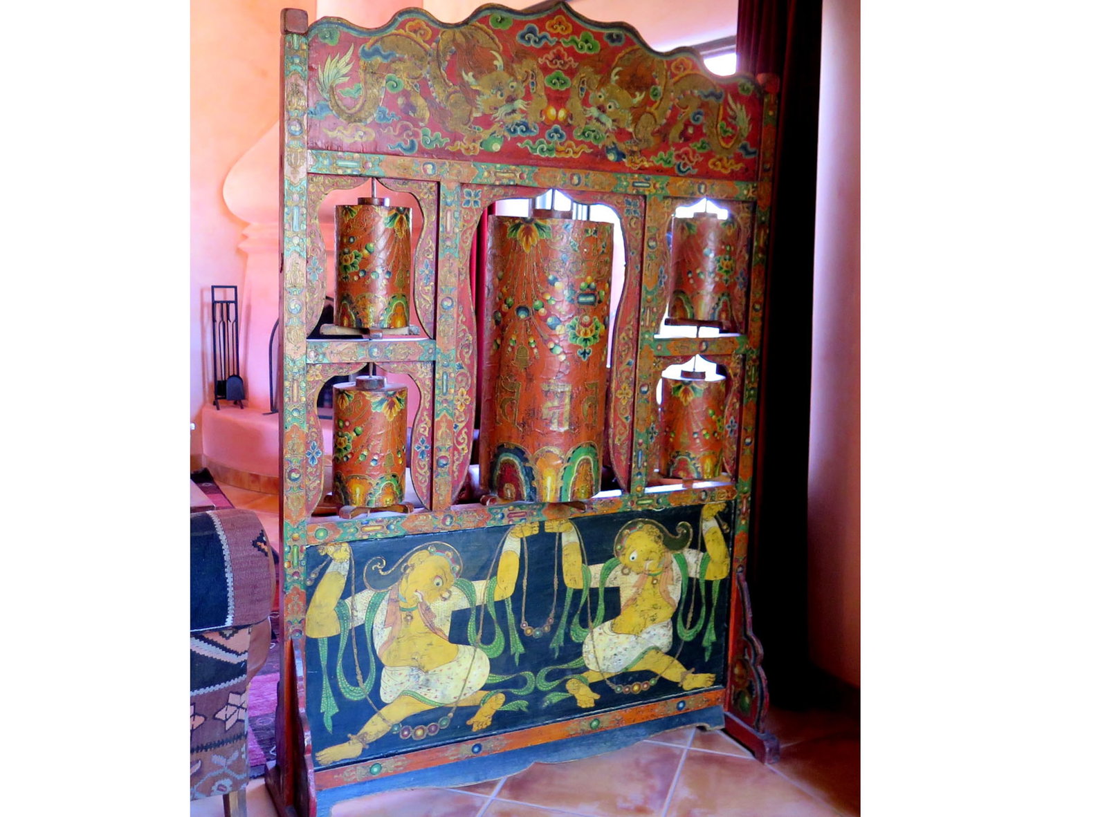 Tibetan Five Prayer Wheel Wall: This freestanding prayer wall was created in Tibet in the late 19th C. A large prayer wheel is framed by two pairs of smaller wheels. With painted scene of two dancers below and two dragons above. Pra