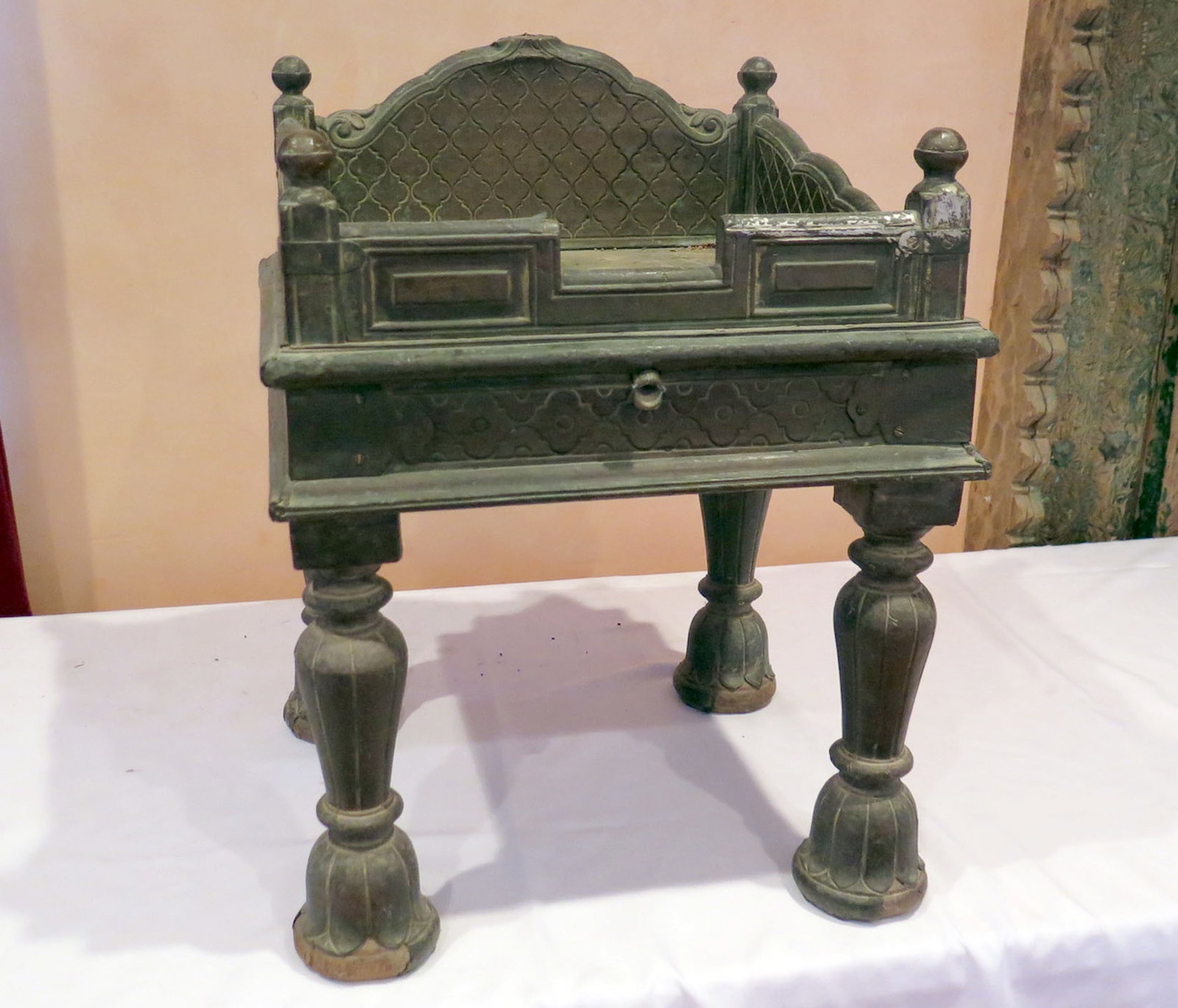 Antique Singhasan Bronze Deity Throne: This throne was a ritual object used to seat a small deity idol, such as a statue of Krishna or Ganesha, during religious ceremonies and prayers. The style is consistent with 19th or early 20th-centur