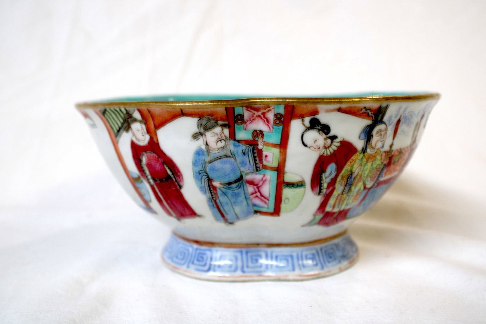Qing Dynasty Tonghzi Famille Rose Porcelain Bowl: The bowl is made of fine white porcelain and decorated with overglaze enamels in the famille rose palette, which is characterized by a range of pink, red, green, blue, and yellow hues. The interior of