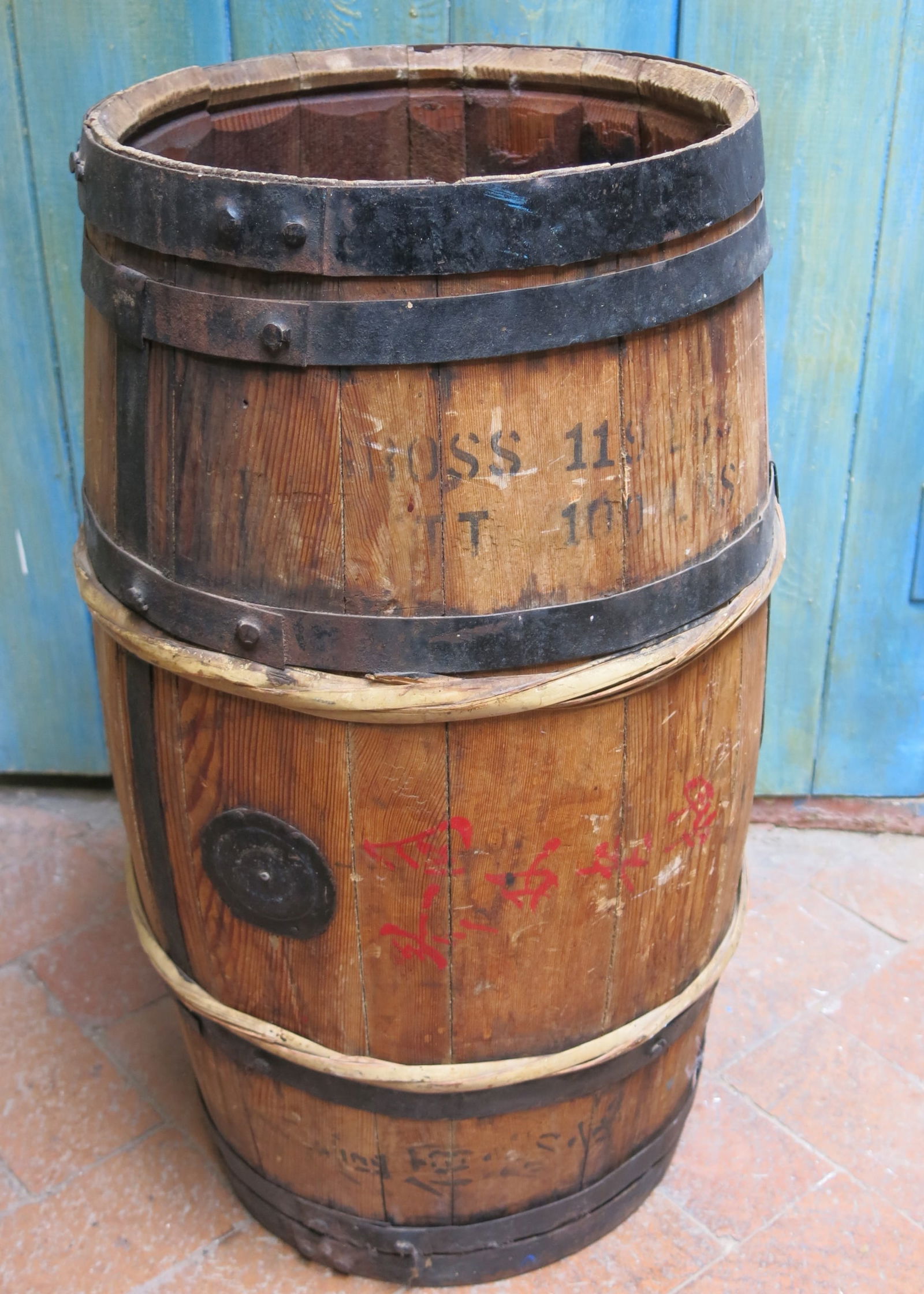 Antique Chinese Wooden Iron Banded Keg: Late 19th early 20th C. six banded keg with lateral support bands. These sturdy kegs were used to transport a variety of goods throughout the seafaring world of the early 20th century.