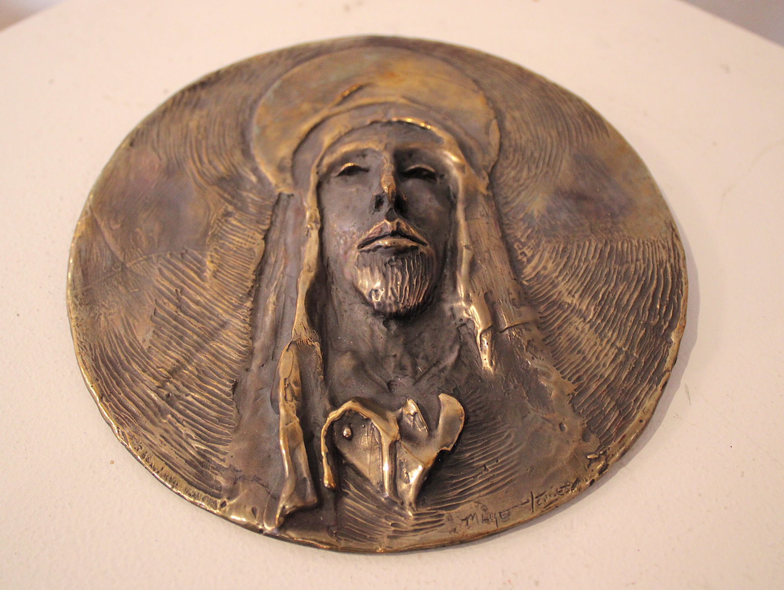 Maye Torres Head Of Christ Bronze: Maye Torres is one of the most dynamic and versatile artists working in Taos, New Mexico. Born in Taos and raised in New Mexico and Latin America she creates cutting edge and innovative drawings and s