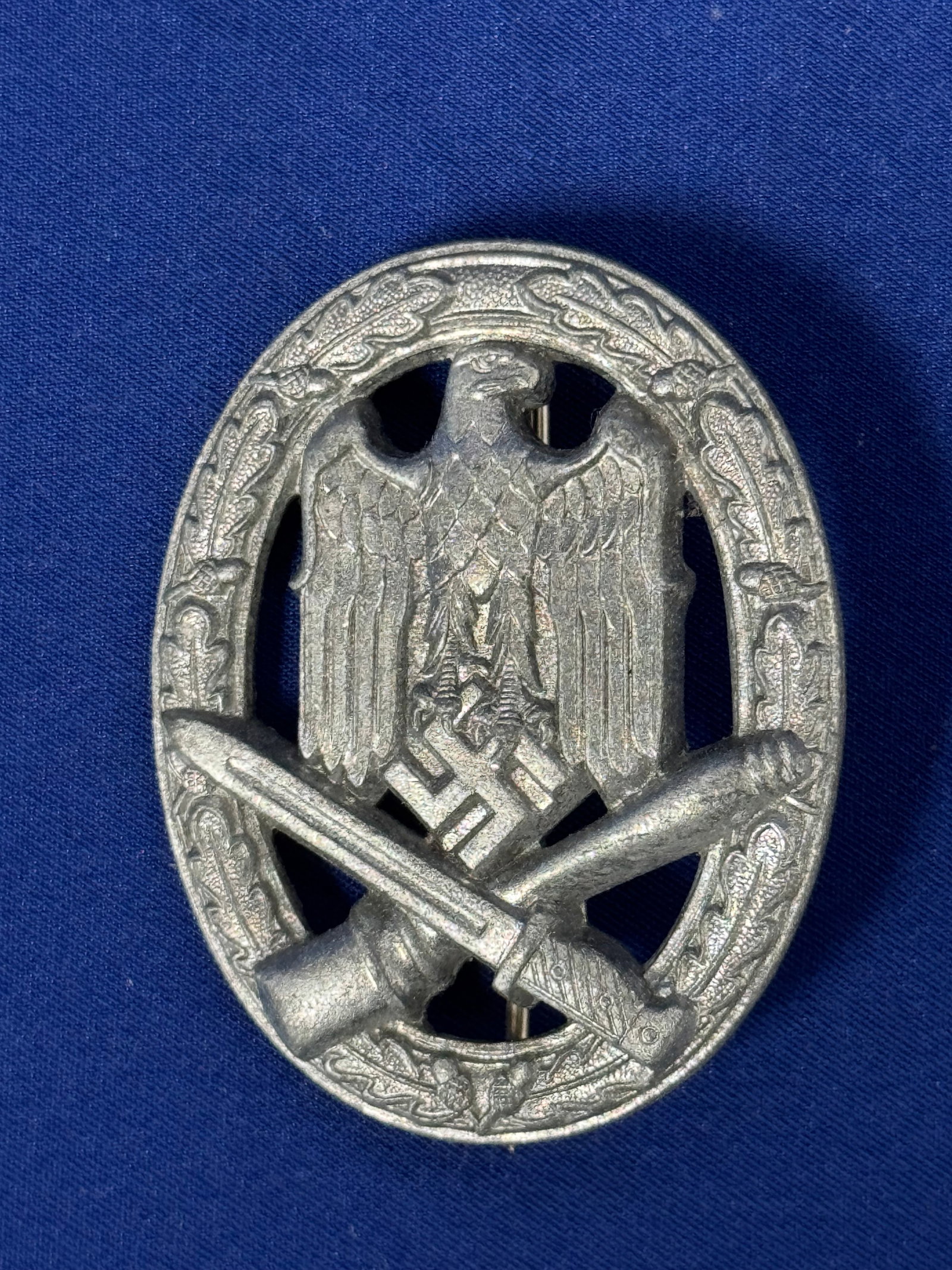 General assault badge by Gustav Brehmer: General assault badge by Gustav Brehmer, Markneukirchen. Zink construction with soldered on set up. Unmarked, typical Brehmer made piece.Very good and unissued condition with super crisp details. No r