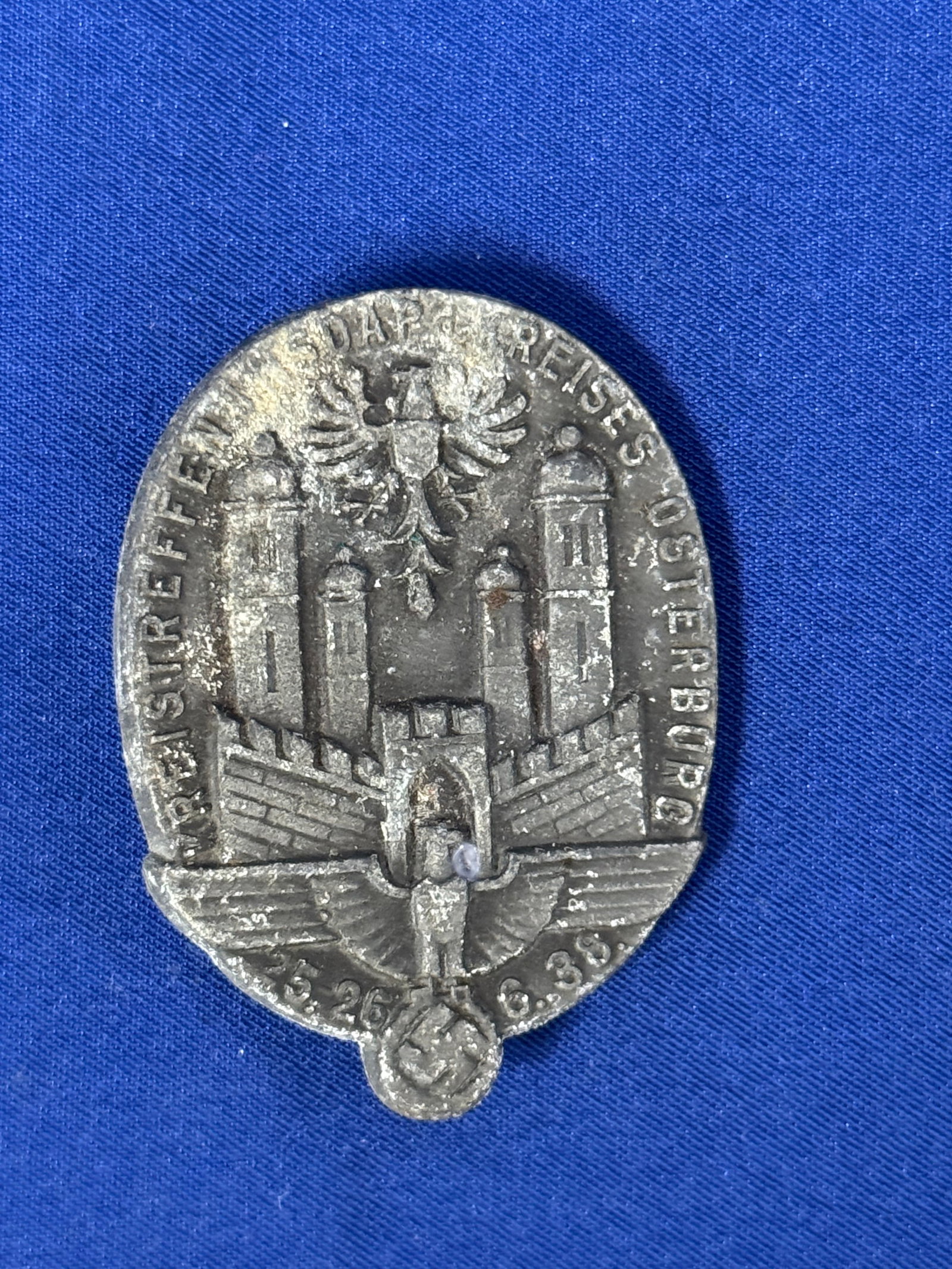 WW2 German NSDAP Meeting Badge Osterburg 1938: The obverse of the oval badge features the Osterburg Coat of Arms above a German National Eagle. And surrounded by: "Kreistreffen d NSDAP d Kreises Osterburg 25-26 6. 38” (Group meetings of the 