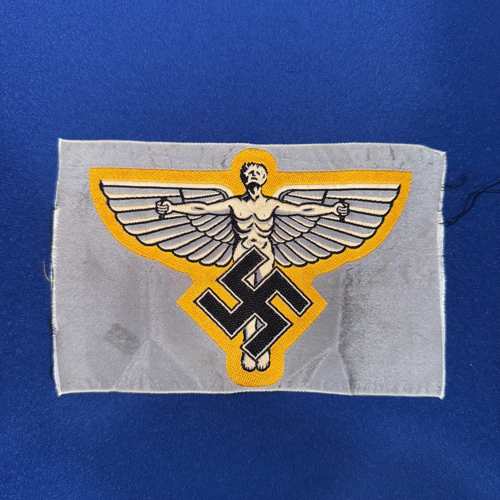 WW2 German NSFK Sport Shirt Cloth Insignia (post war): WW2 German NSFK Sport Shirt Cloth InsigniaWe do not know the authentic if this item please bid accordingly
