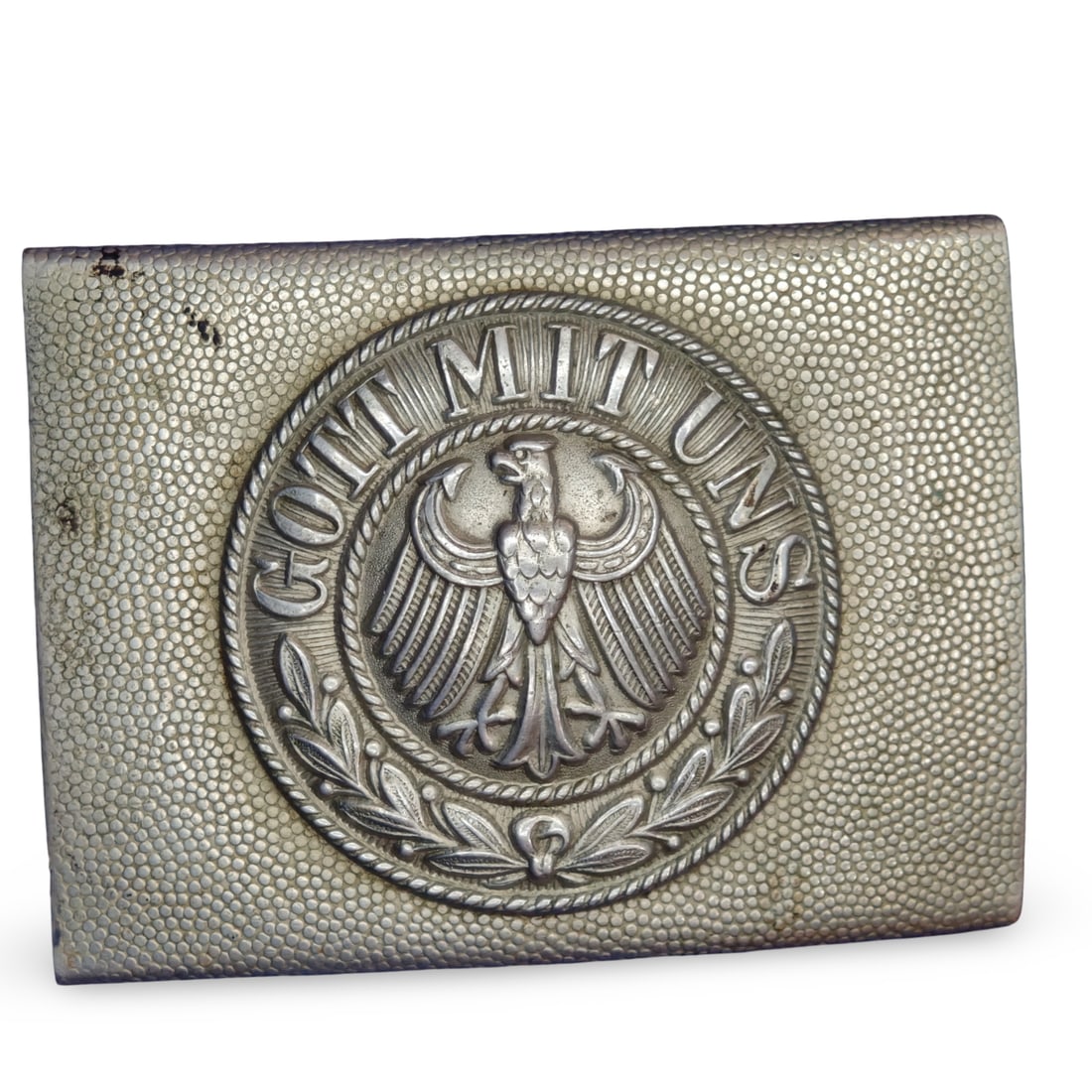 Pre-WWII Weimar Republic Reichswehr Belt Buckle: Stamped sheet metal box with a metallic alloy roundel.Rolled metal prong bar sleeve with dual prongs and an integral folded catch.