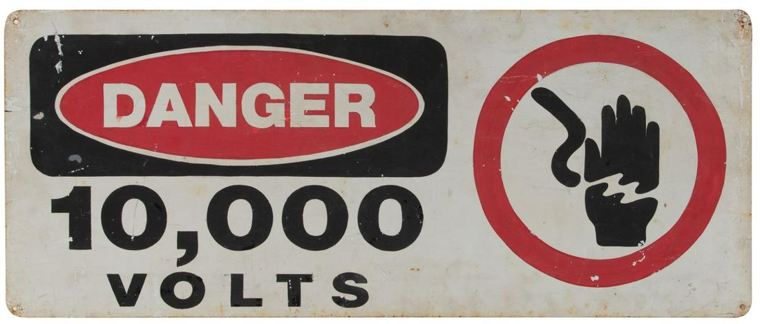 'High Voltage' dinosaur pen sign from Jurassic Park.: High Voltage dinosaur pen sign from Jurassic Park. (Universal, 1993) Original large metal sign expertly painted white, black and red, measuring 34 x 14 in. Exhibiting intentional studio distress and w