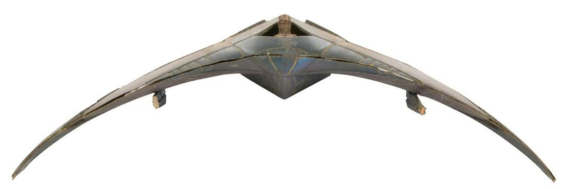 'Goa'uld Death Glider' small scale filming miniature: Goa'uld Death Glider small scale filming miniature from Stargate. (Carolco, 1994) Original filming miniature constructed of fiberglass with resin components and slightly curved appearance, similar to