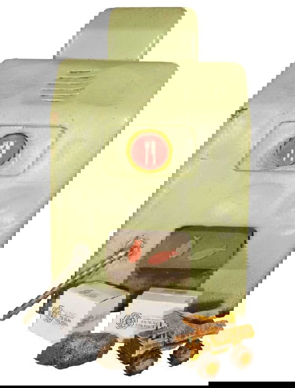 DHARMA fish biscuit machine and 30+ fish biscuits: DHARMA fish biscuit dispensing machine and 30+ fish biscuits. DHARMA fish biscuit dispensing machine and collection of 30+ DHARMA-branded fish biscuits. Seen during Sawyer's captivity in the Hydra cag