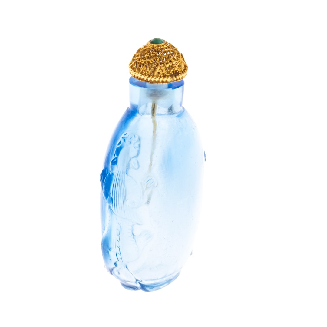 CHINESE BLUE TIGER GLASS SNUFF BOTTLE WITH GILT FILIGREE TOP: From a collection of Wedgwood and other selected ceramic/porcelain objects. Kindly examine all photographs provided in this listing or ask for a condition report. All items offered are in generally go