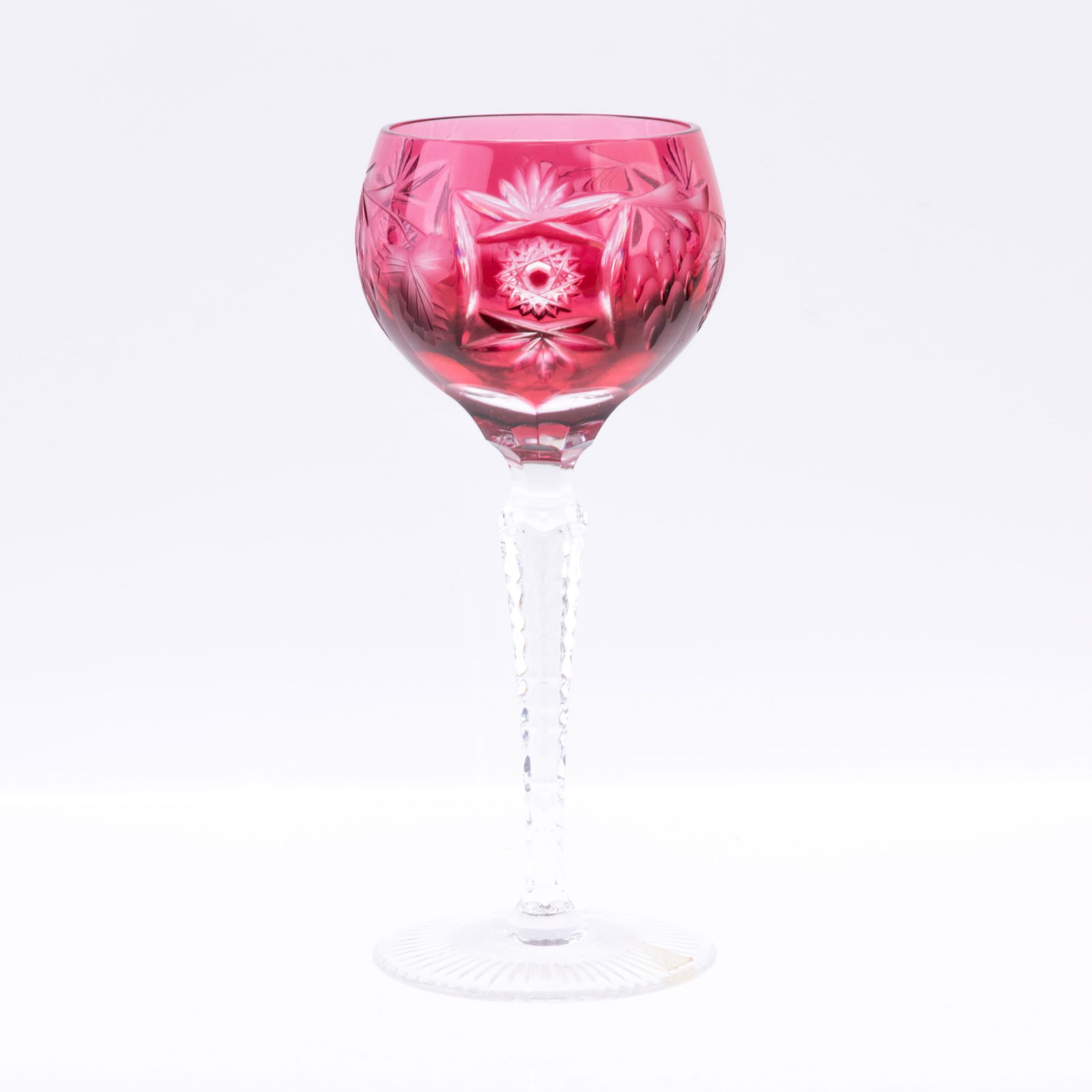 CRANBERRY CUT CRYSTAL HOCK WINE GLASS: (H) 17CM. From a collection of Wedgwood and other selected ceramic/porcelain objects. Kindly examine all photographs provided in this listing or ask for a condition report. All items offered are in ge