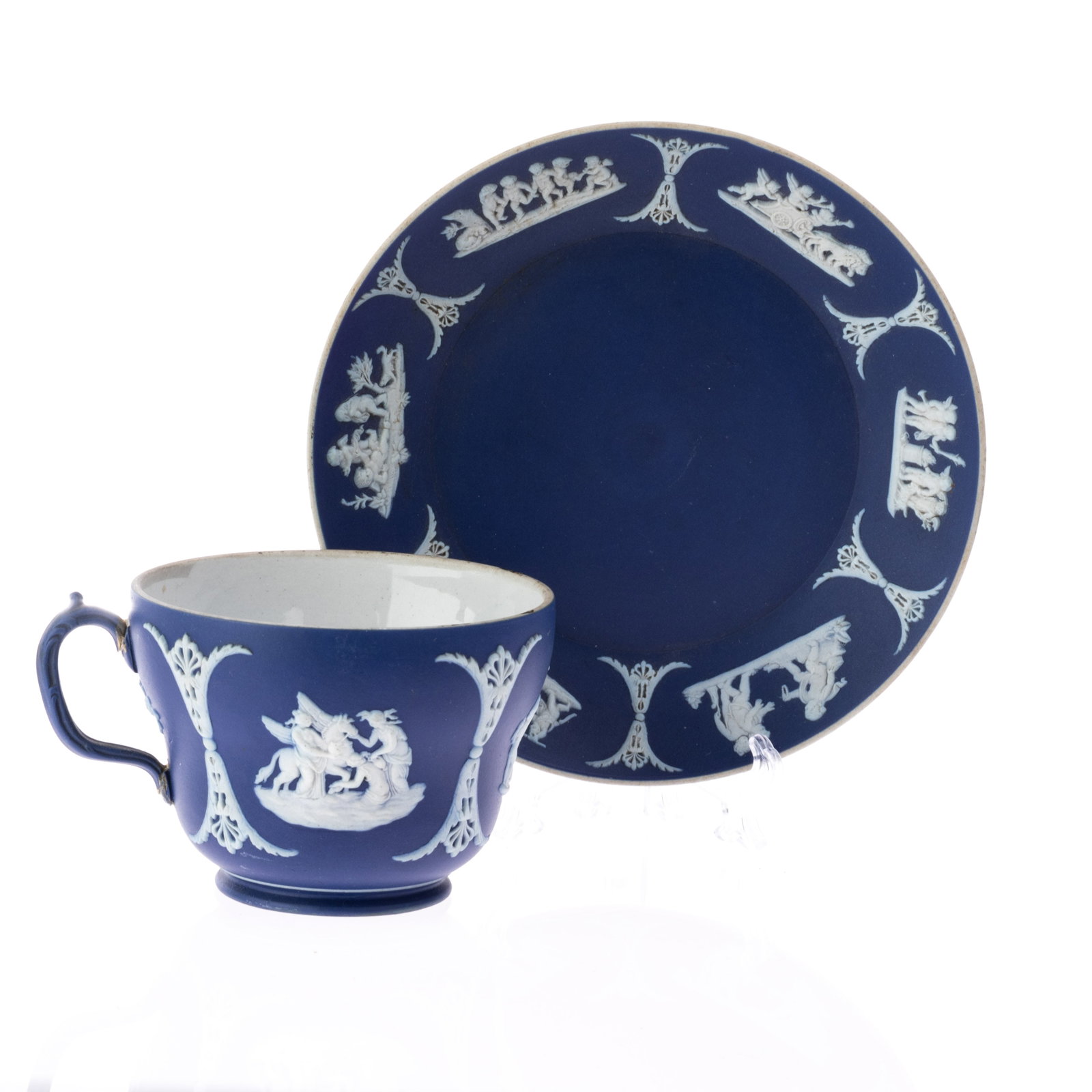WEDGWOOD PORCELAIN CERAMIC JASPER TEAPOT AND SAUCER: (DIA) 14CM.From a collection of Wedgwood and other selected ceramic/porcelain objects. Kindly examine all photographs provided in this listing or ask for a condition report. All items offered are in g