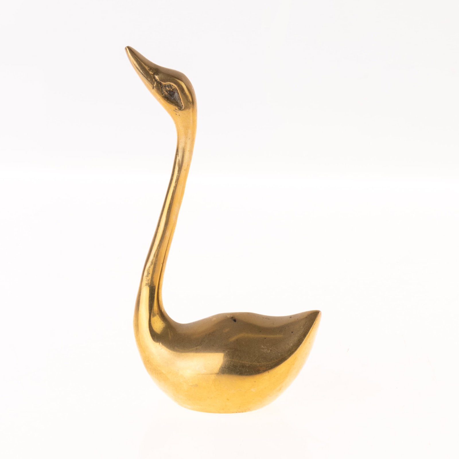 MID-CENTURY BRASS DUCK SCULPTURE: From a collection of Wedgwood and other selected ceramic/porcelain objects. Kindly examine all photographs provided in this listing or ask for a condition report. All items offered are in generally go