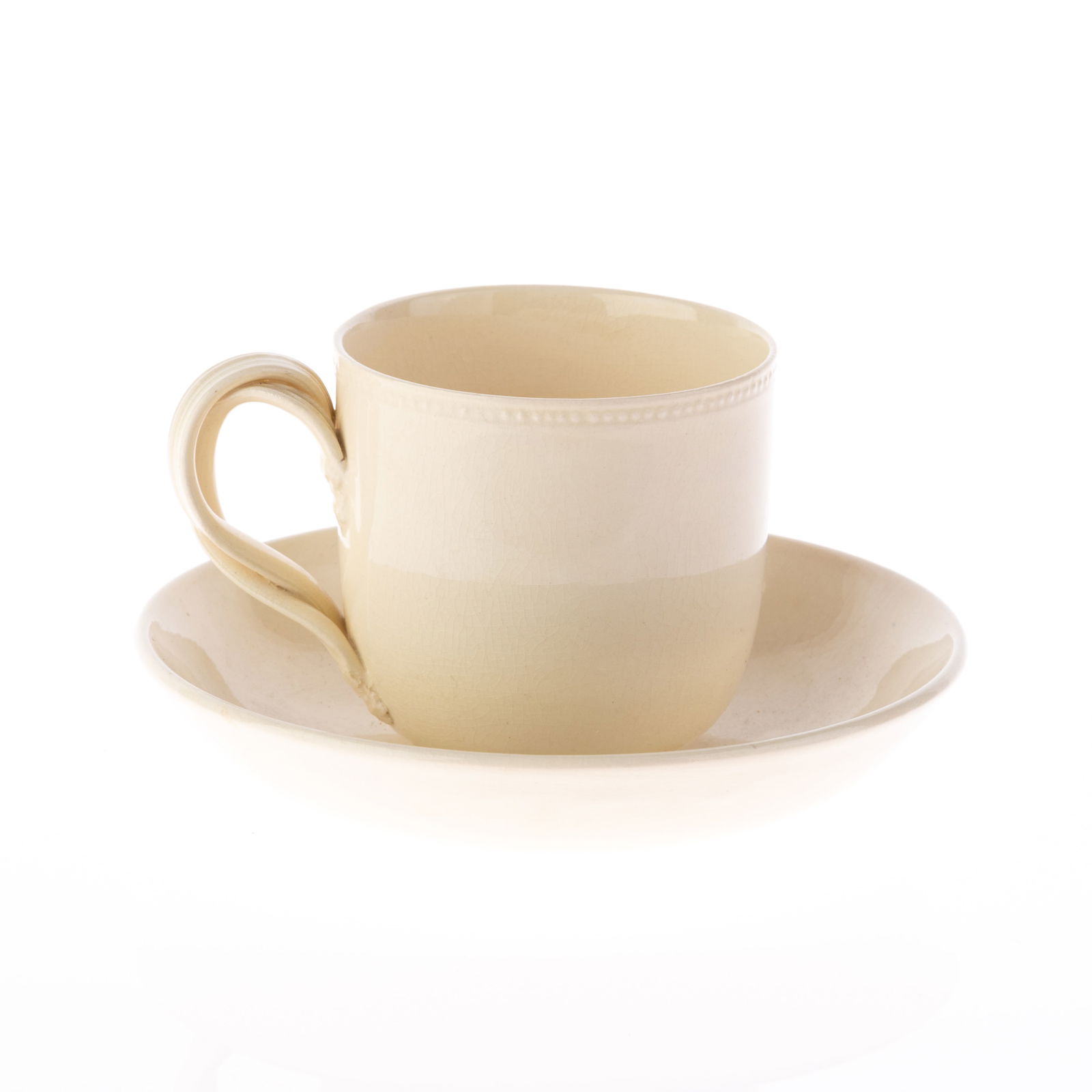 CREAMWARE PORCELAIN CUP AND SAUCER (1 of 2)
