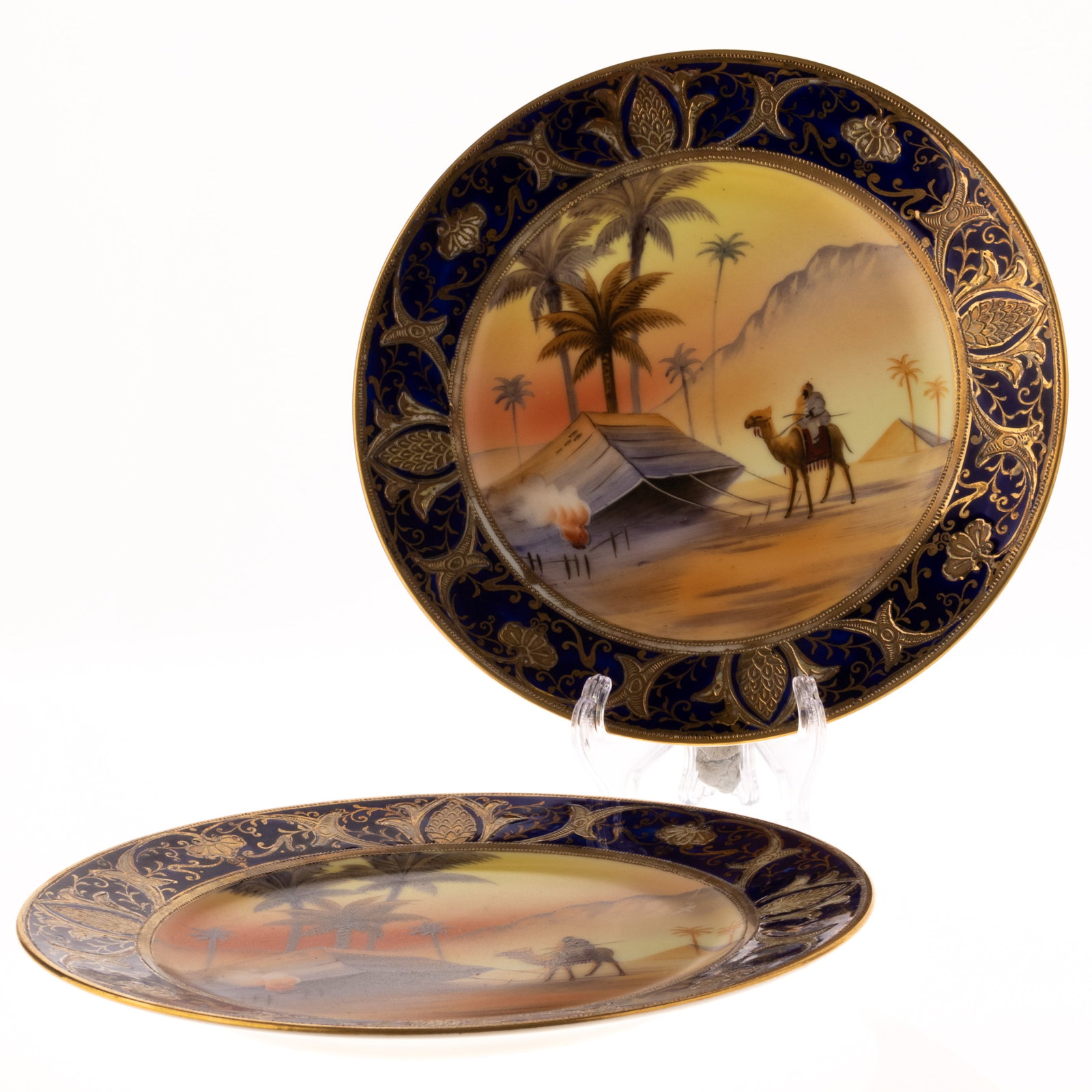 2X NORITAKE GILT PORCELAIN ART DECO ORIENTALIST PLATES: From a collection of Wedgwood and other selected ceramic/porcelain objects. Kindly examine all photographs provided in this listing or ask for a condition report. All items offered are in generally go