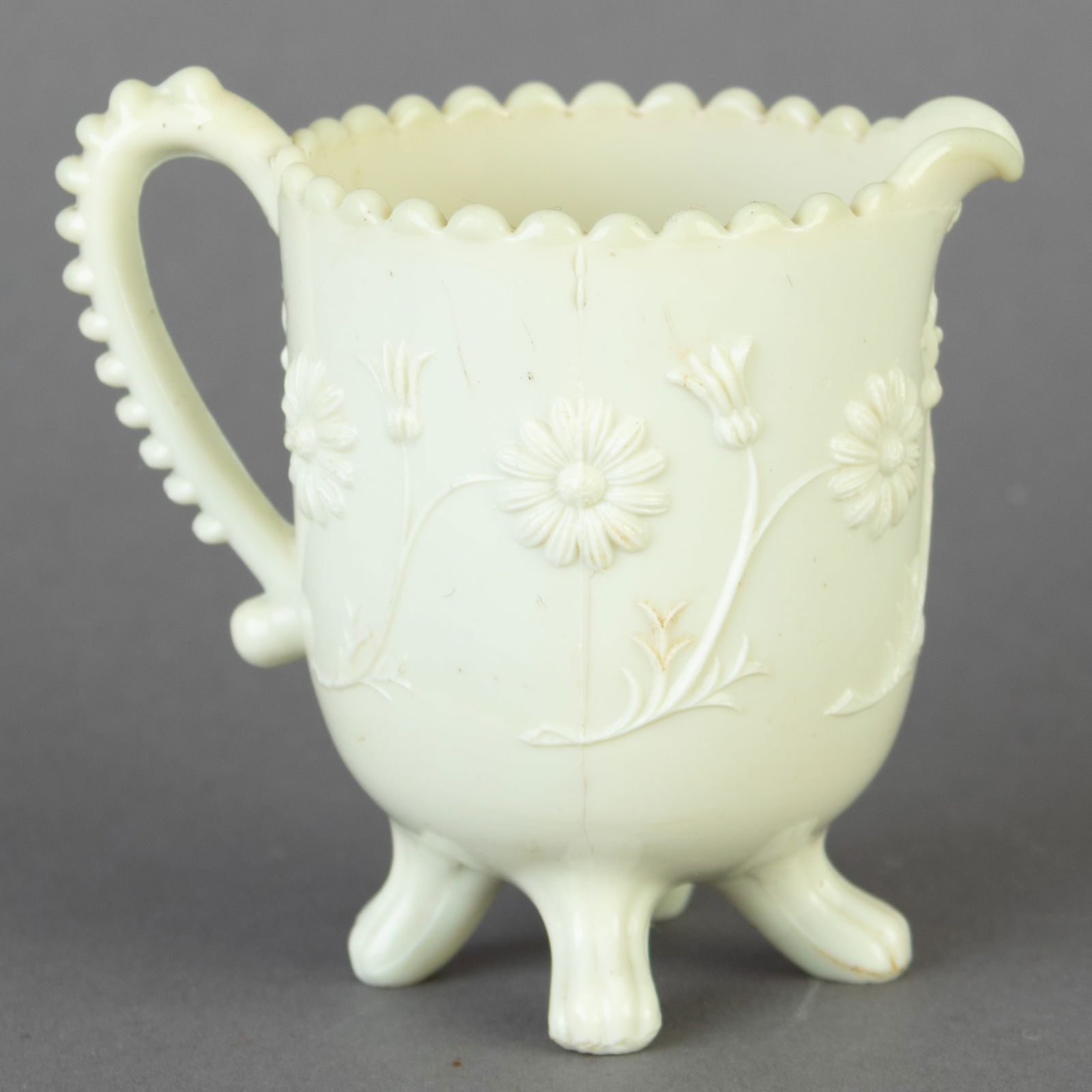 EARLY ART NOUVEAU MILK PRESSED GLASS CREAMER JUG: From a collection of Wedgwood and other selected ceramic/porcelain objects. Kindly examine all photographs provided in this listing or ask for a condition report. All items offered are in generally go