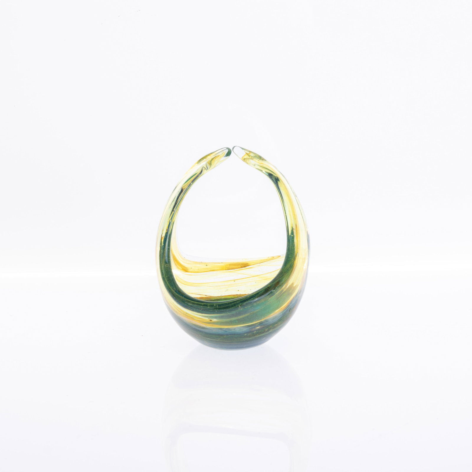 MDINA GLASS BASKET: 7x8.5x10.5CM.From a collection of Wedgwood and other selected ceramic/porcelain objects. Kindly examine all photographs provided in this listing or ask for a condition report. All items offered are in